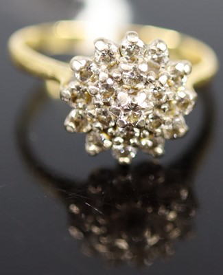 Lot 343 - An 18ct gold diamond cluster ring, arranged as...