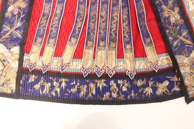 Lot 142 - A Chinese red-ground silk embroidered “floral”...