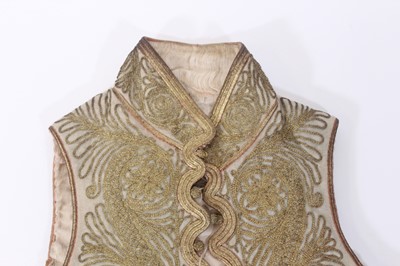Lot 147 - A ceremonial embroidered vest together with...