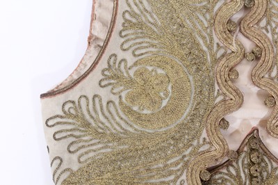 Lot 147 - A ceremonial embroidered vest together with...