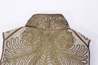 Lot 147 - A ceremonial embroidered vest together with...