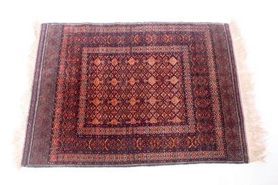 Lot 150 - An Afghan part silk and part fine wool rug,...