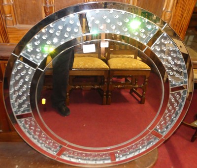 Lot 1128 - A contemporary circular wall mirror, with...