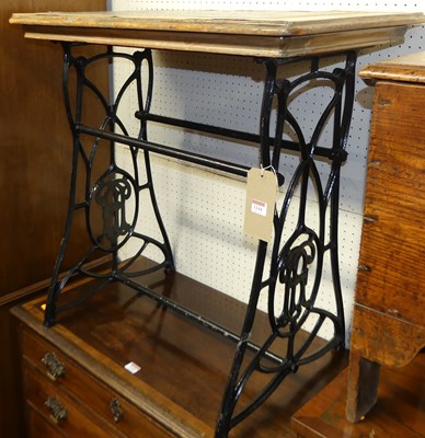 Lot 1144 - A cast iron based and tile inset topped...