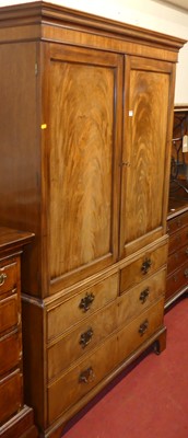 Lot 1146 - A 19th century mahogany linenpress, the twin...