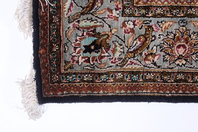 Lot 149 - A Persian Qom silk rug, mid-20th century...