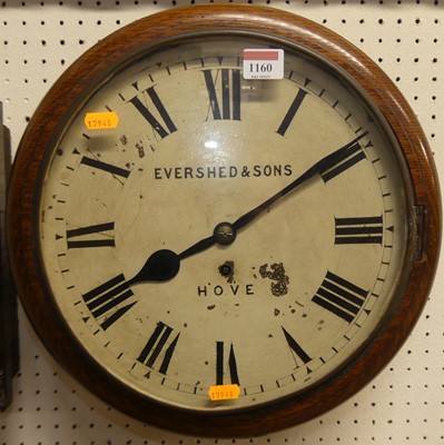 Lot 1160 - A Victorian oak circular wall clock, the white...