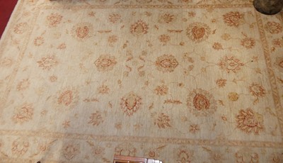 Lot 1177 - A Persian woollen pale ground Ziegler rug, 283...