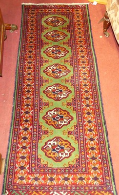 Lot 1178 - A Persian woollen red and green ground Bokhara...