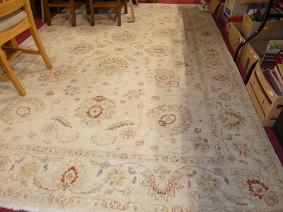 Lot 1185 - A Persian woollen cream ground Isfahan rug,...