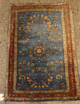 Lot 1190 - A Persian woollen red ground Bokhara rug, 185...