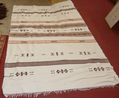 Lot 1197 - An African tribal Fulani blanket, pale ground...