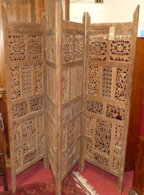 Lot 1207 - An Indonesian teak floral relief carved and...