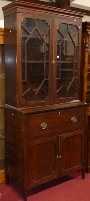 Lot 1214 - A Regency mahogany secretaire bookcase, having...