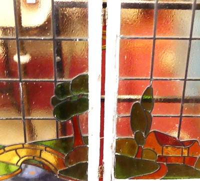 Lot 1218 - A pair of early 20th century coloured leaded...