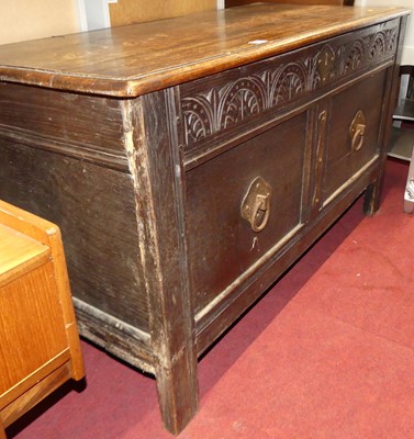 Lot 1244 - An 18th century oak and later line carved twin...