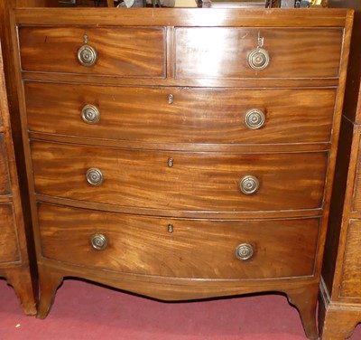 Lot 1253 - A Regency mahogany and chequer strung bowfront...