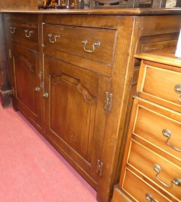 Lot 1266 - A joined oak double door side cupboard in the...