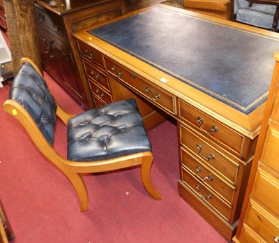 Lot 1268 - A contemporary yew twin pedestal writing desk,...