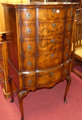 Lot 1271 - A 1930s walnut and figured walnut bowfront...
