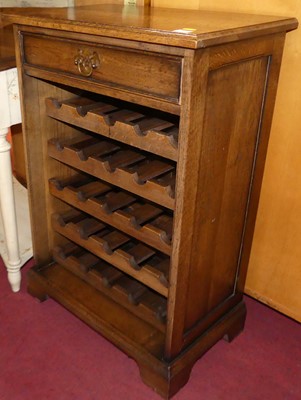 Lot 1273 - A contemporary joined oak freestanding wine...