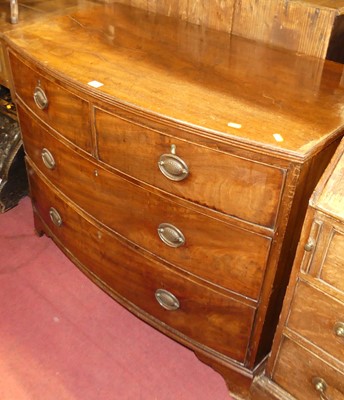 Lot 1281 - A mid-19th century mahogany low bowfront chest,...