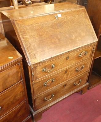 Lot 1282 - A circa 1800 provincial oak slopefront three...