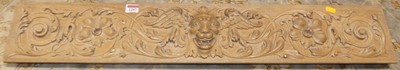 Lot 1297 - A blond oak Green Man masked and floral relief...