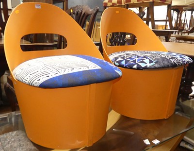Lot 1309 - A pair of retro orange painted curved ply side...