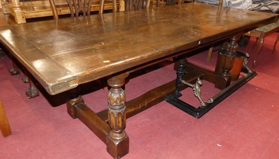 Lot 1315 - A joined oak plank topped refectory dining...