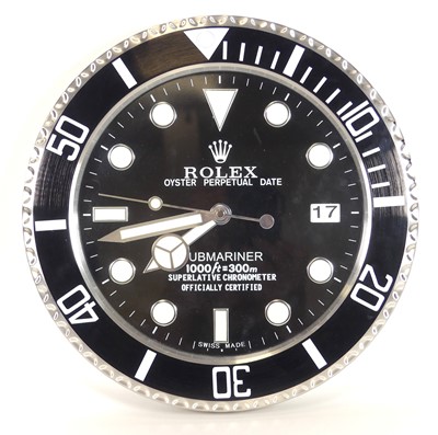 Lot 501 - A contemporary brushed metal wall clock, in...