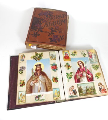 Lot 502 - An early 20th century leather bound scrapbook...