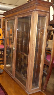 Lot 1324 - An Edwardian walnut double door glazed wall...