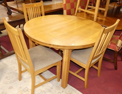 Lot 1329 - A contemporary joined blond oak dining suite,...