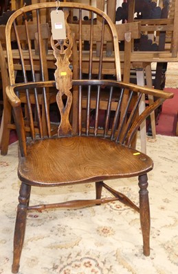 Lot 1331 - A 19th century elm and fruitwood wheelback...