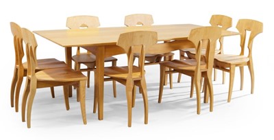 Lot 1336 - A contemporary blond oak dining suite,...