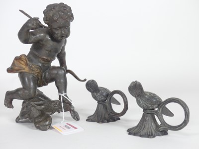 Lot 509 - A bronzed metal figure of a putti, h.17.5cm,...