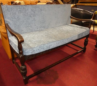 Lot 1358 - An early 20th century floral relief carved oak...