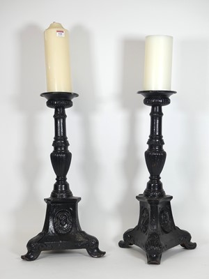 Lot 520 - A pair of black painted cast iron pricket...