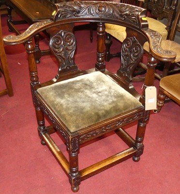 Lot 1368 - A circa 1900 heavily floral carved oak tub...