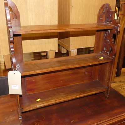 Lot 1382 - An Edwardian pierced walnut three-tier wall...