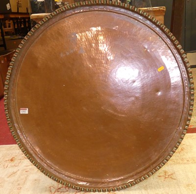 Lot 1392 - A large Eastern copper circular tray, having a...