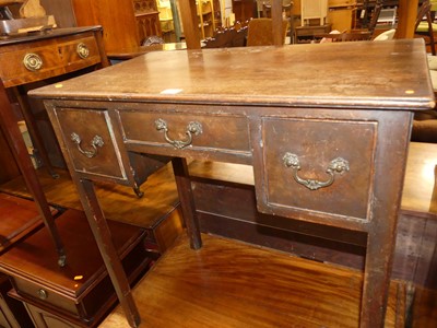 Lot 1398 - A provincial George III mahogany three drawer...