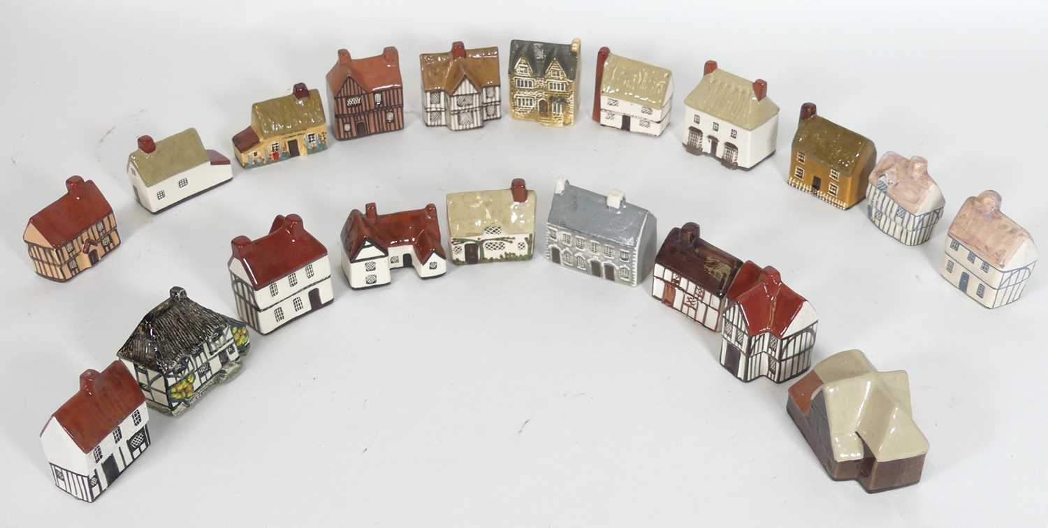 Lot 55 - A collection of Mudlen studio pottery cottages,...