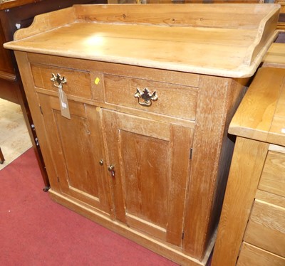 Lot 1417 - A rustic pine three-quarter gallery backed two...