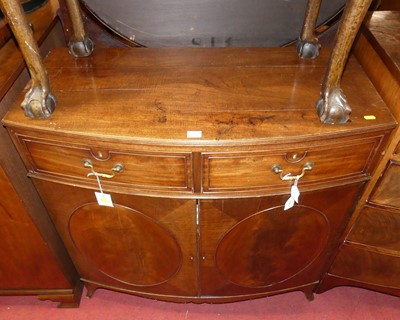 Lot 1429 - A 19th century mahogany bowfront double door...