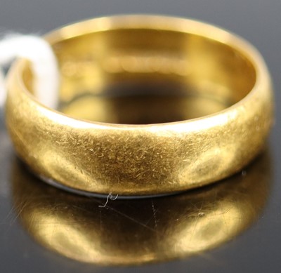 Lot 347 - A 22ct gold court shaped wedding band, sponsor...