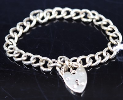 Lot 379 - A 9ct gold hollow curblink bracelet, with...