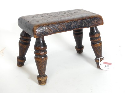 Lot 131 - A 19th century provincial elm stool, having a...
