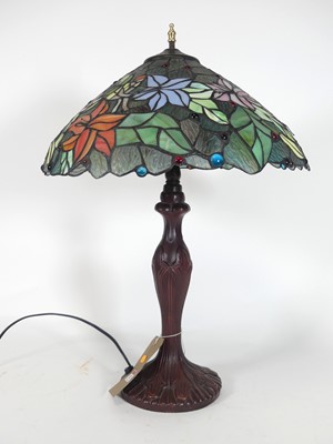 Lot 132 - A Tiffany style table lamp having a floral...